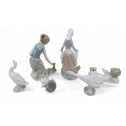 175 - A group of six Lladro figures, largest 23cm high, two with boxes. (6)