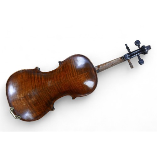 126 - A 19th century Continental violin, in need of restoration, bearing a faded label 'Stradivarius', ove... 