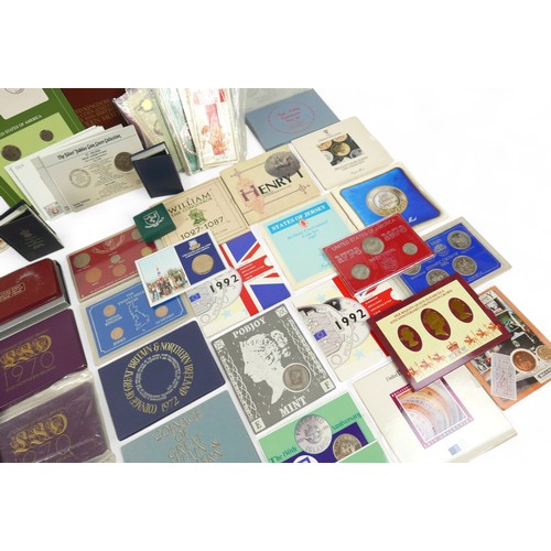 8 - A large collection of United Kingdom proof sets and coins, over sixty in total. (1 box)