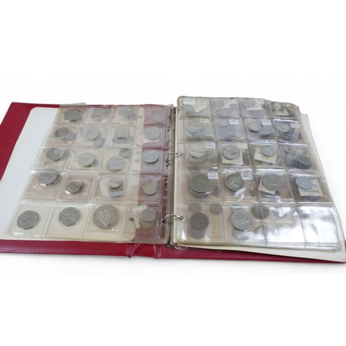 9 - A collection of world coins, in five albums and loose dating from George III. (1 box)