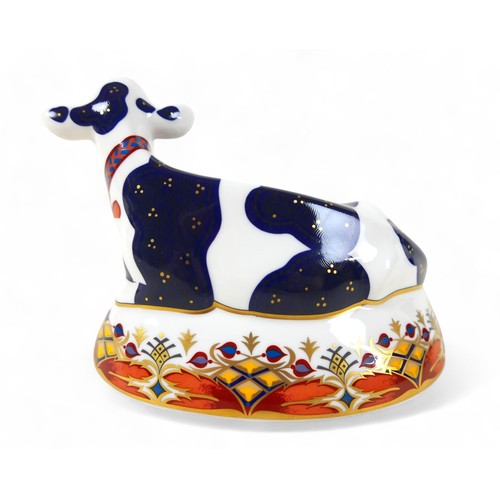 184 - A Royal Crown Derby paperweight, modelled as 'Friesian Cow Buttercup', with gold stopper, boxed.