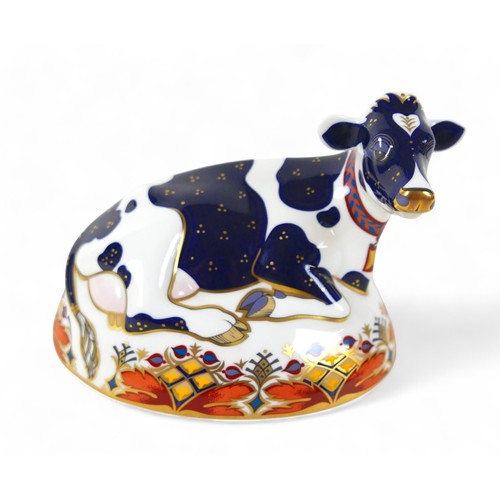 184 - A Royal Crown Derby paperweight, modelled as 'Friesian Cow Buttercup', with gold stopper, boxed.