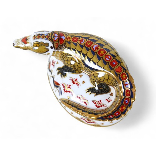 185 - A Royal Crown Derby paperweight, modelled as 'Crocodile', with gold stopper, boxed.