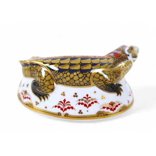 185 - A Royal Crown Derby paperweight, modelled as 'Crocodile', with gold stopper, boxed.