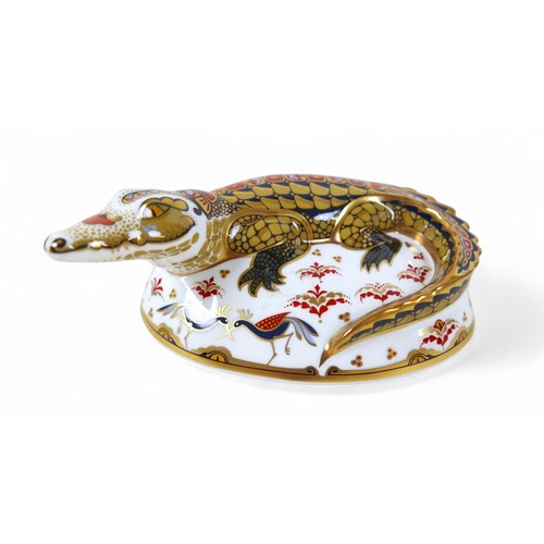 185 - A Royal Crown Derby paperweight, modelled as 'Crocodile', with gold stopper, boxed.