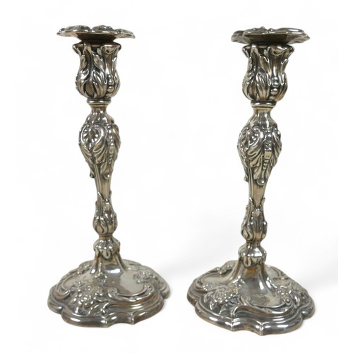 57 - A pair of Victorian rococo style weighted silver candlesticks, attributed to William Ryland, Birming... 