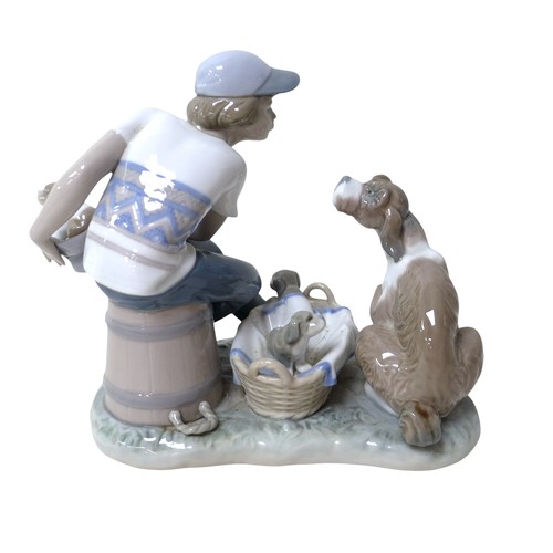 182 - A pair of Lladro heron candlesticks, a Copenhagen B&G figure and two further Lladro figures. (5)