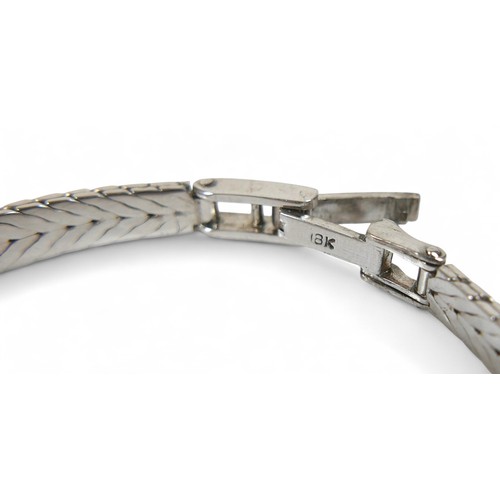 100 - A jade, 18k white gold and diamond bracelet, set in the 1960's, the spray design with five marquise-... 