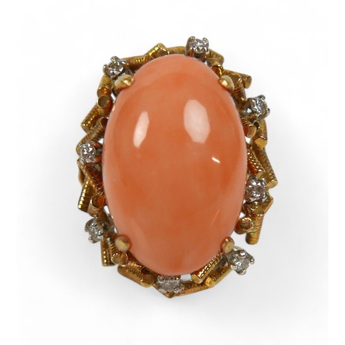 99 - A 14k gold, diamond and coral ring, circa 1960's, the pale pink oval cabochon coral approx 19 by 12m... 