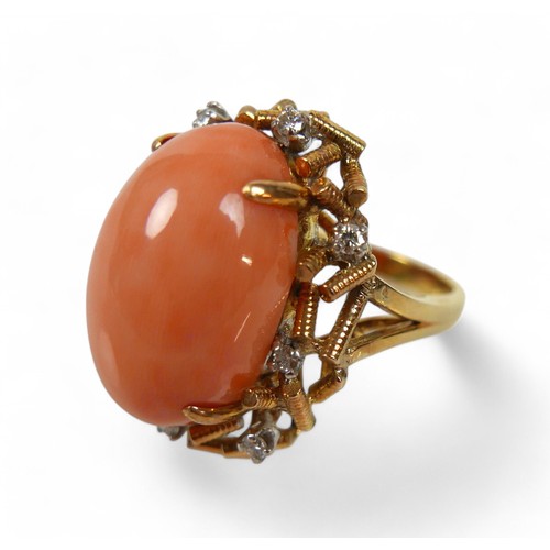 99 - A 14k gold, diamond and coral ring, circa 1960's, the pale pink oval cabochon coral approx 19 by 12m... 