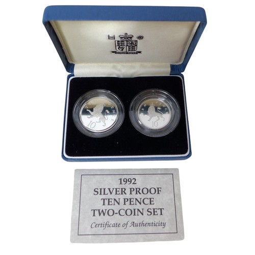 33 - A collection of Royal Mint silver proof coin sets, including a 2006 Queen Elizabeth Eightieth Silver... 