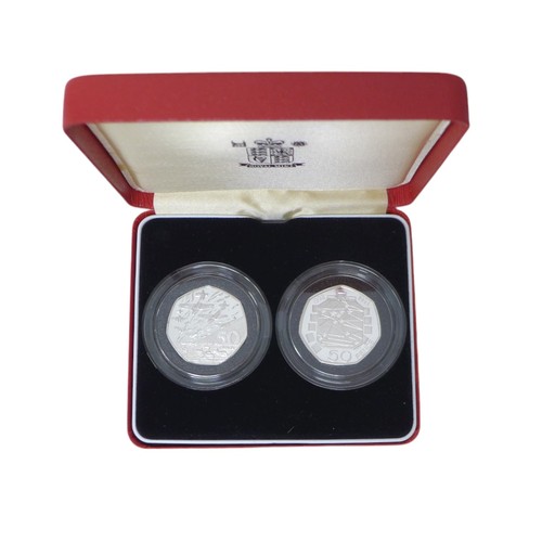 36 - A Collection of Royal Mint Piedfort fifty pence coin sets, including two, two-coin sets, together wi... 