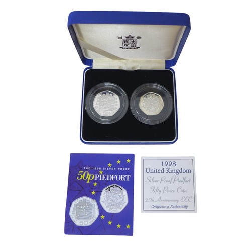 36 - A Collection of Royal Mint Piedfort fifty pence coin sets, including two, two-coin sets, together wi... 