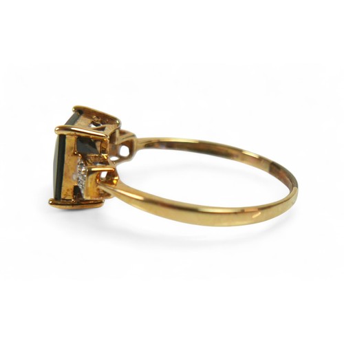 76 - A 9ct yellow gold garnet and diamond ring size T, weight 2.2g.