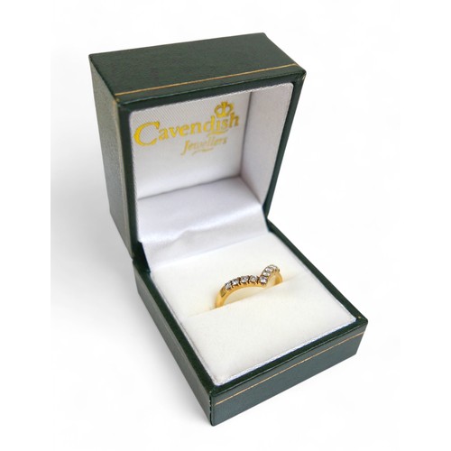 88 - An 18ct yellow gold nine stone diamond wishbone ring, size P, weight 2.3g.