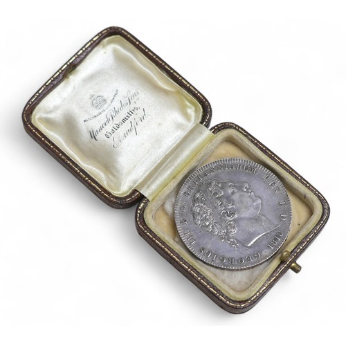 47 - A George III silver crown, 1818, with associated hard case.