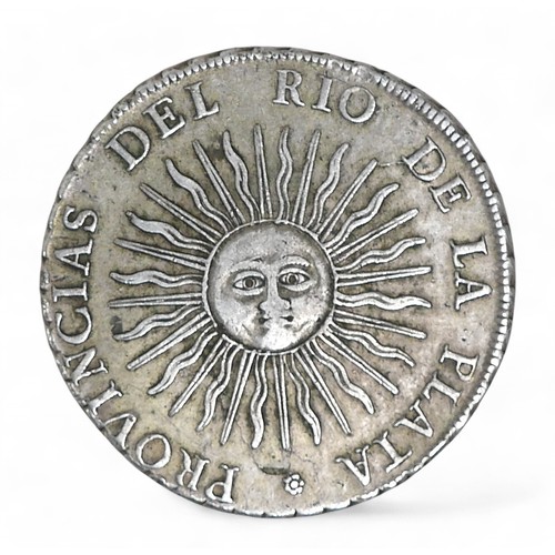 49 - A South American, 1813 8 Reales coin, with legend 'PROVINCIAS DEL RIO DE LA PLATA', approximately 38... 