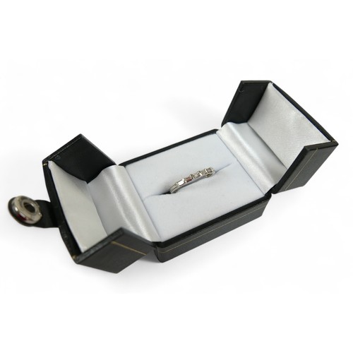 71 - A 9ct white gold ring, set with five small baguette cut diamonds, size N, 1.7g, with box.