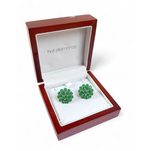 84 - A pair of emerald cluster earrings, set on 925 silver backings, total diameter 2.1cm, with box.