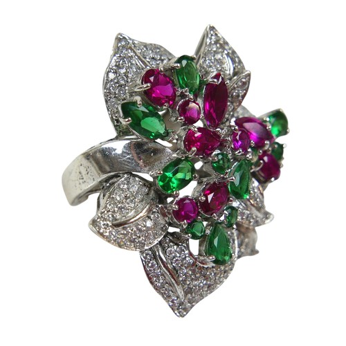 98 - A rhodium-plated silver cocktail ring, set with pink, green and white topaz in a large floral design... 