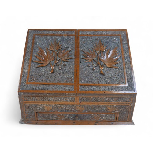 143 - An Eastern carved stationary box, with Medical Corp carving, 38 by 19 by 28cm.