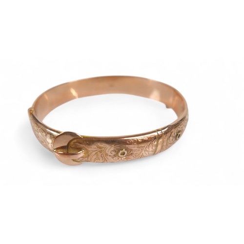 78 - A 9ct rose gold hollow bangle, in the form of a belt, 7 by 6 by 1cm external, with box, 11.3g.