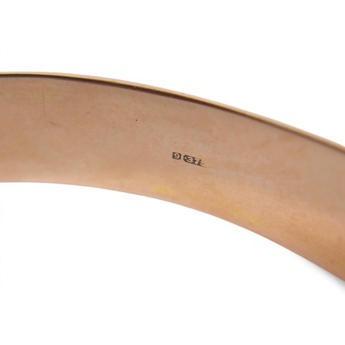 78 - A 9ct rose gold hollow bangle, in the form of a belt, 7 by 6 by 1cm external, with box, 11.3g.