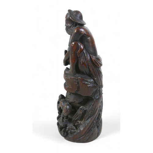 147 - A carved root wood Oriental figure, 13 by 12 by 31cm high.