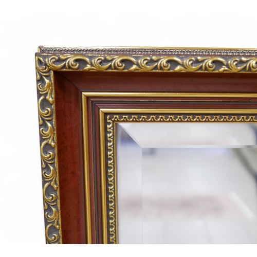 233 - A decorative wall mirror, 130 by 4 by 100cm.