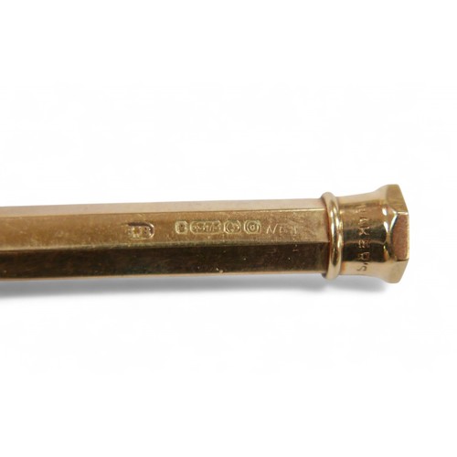 61 - A 9ct gold propelling pencil, inscribed 'James 1947', 16.1g, 8.8cm long.