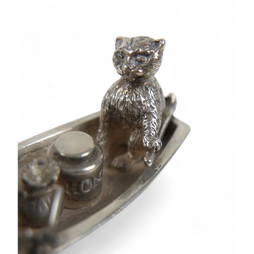 8 - An Elizabeth II silver miniature novelty bibelot, modelled as 'The Owl and The Pussy Cat', both seat... 