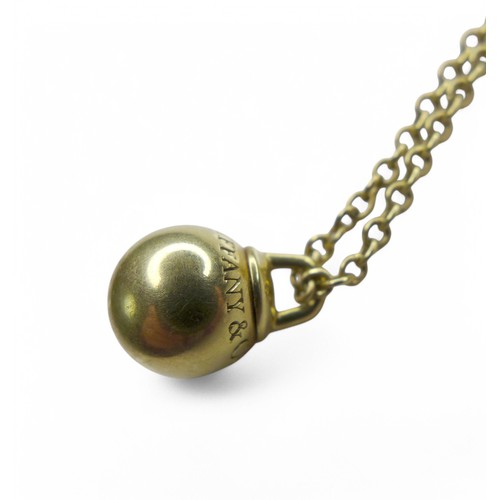 67 - A Tiffany & co 18ct gold Hardware Ball necklace, with thin chain and golden ball pendant, marked Au ... 