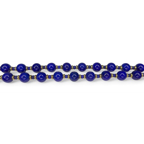 43 - A lapis lazuli bead necklace on 18ct gold clasp, the beads interspersed with gold spacer beads, mark... 