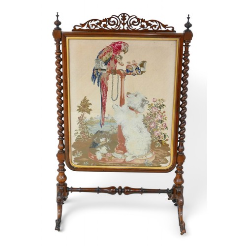 201 - An interesting Victorian rosewood needlepoint fire screen, the design is of a Landseer painting of Q... 