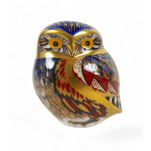 110 - A group of three Royal Crown Derby paperweights, comprising a cheetah, an owl, and a goldcrest. (3)