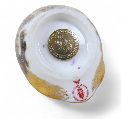 110 - A group of three Royal Crown Derby paperweights, comprising a cheetah, an owl, and a goldcrest. (3)