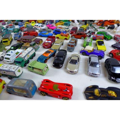 135 - A collection of unboxed die cast vehicles, including Corgi, Britains, Matchbox and others. (2 boxes)