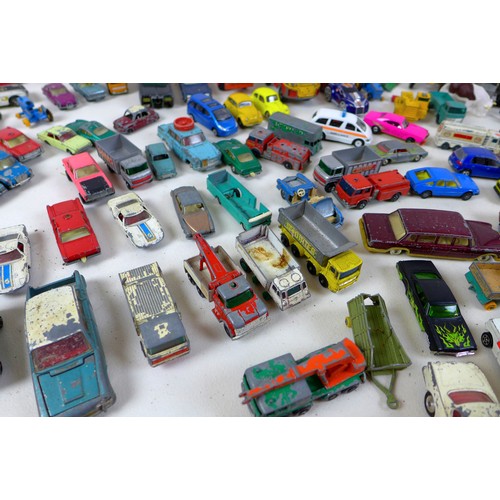 135 - A collection of unboxed die cast vehicles, including Corgi, Britains, Matchbox and others. (2 boxes)