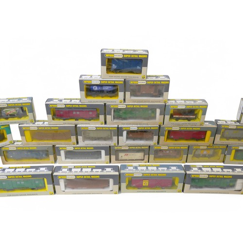 140 - A collection of OO gauge trains and rolling stock, to include thirty three boxed Wren trucks. (2 box... 