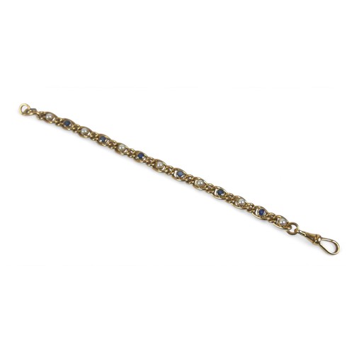 74 - A 9ct yellow gold sapphire and pearl chain link bracelet, 19cm long by 6.6mm, 16.5g.