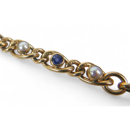 74 - A 9ct yellow gold sapphire and pearl chain link bracelet, 19cm long by 6.6mm, 16.5g.