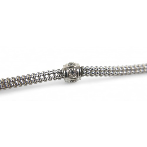 33 - A 9ct white gold bracelet, 19cm long by 5.5mm wide, 6.0g.