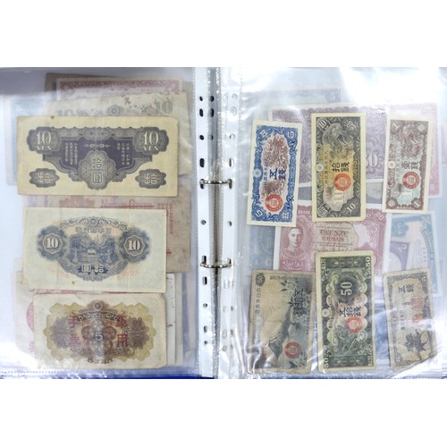 87 - An album of WWII and later Chinese, Japanese and other banknotes, together with an album of 1970s Fi... 