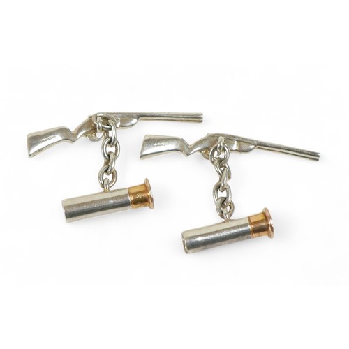 32 - A pair of silver shotgun and cartridge cufflinks, 4cm long. (2)