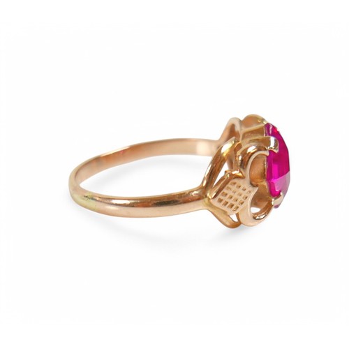 31 - A 14ct yellow gold ruby/pink sapphire ring, size O, stone size 6.5 by 6.5 by 4.5mm, weight 2.9g.