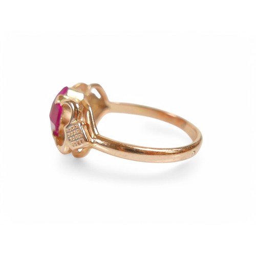 31 - A 14ct yellow gold ruby/pink sapphire ring, size O, stone size 6.5 by 6.5 by 4.5mm, weight 2.9g.