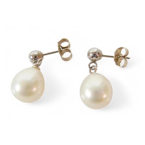 26 - A string of pearls and earrings with 14ct white gold clasp and stud fittings, pearls are approximate... 