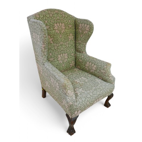 199 - Two wing back upholstered armchairs, both on carved front legs, largest 78 by 82 by 107cm high. (2)