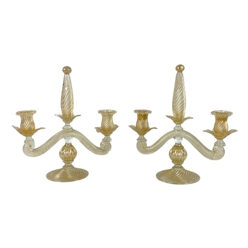 113 - A pair of clear and gold glass twist candelabra, two-branch, hand blown, in the Venetian style, unsi... 