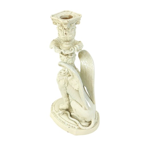 111 - A late 18th century Staffordshire Neale & Co creamware figural candlestick, modelled as a female sph... 